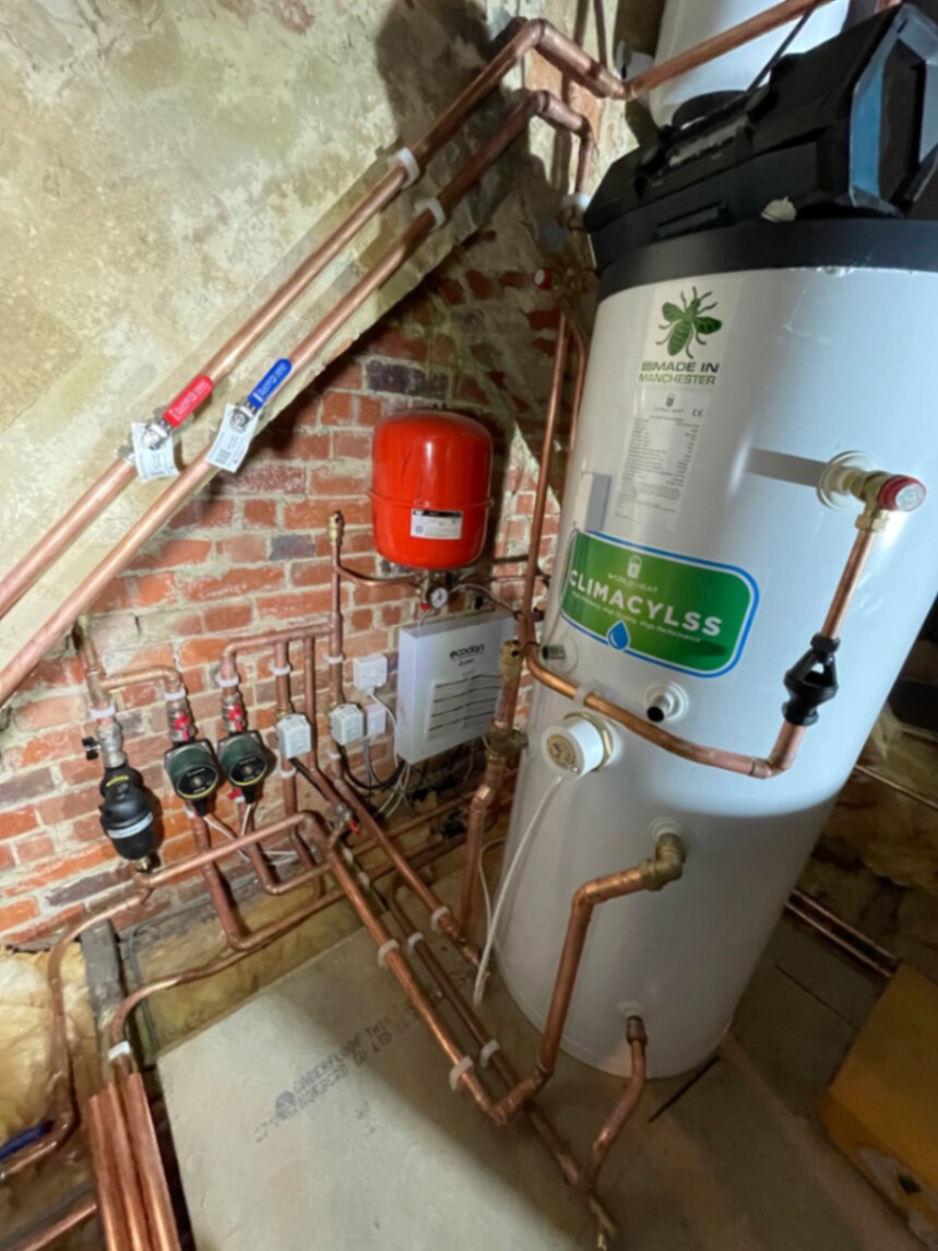 Unvented hot water cylinder, expansion vessel and copper heating manifold installed by Jeremy Griffiths-Ozanne of GO Plumbing and Heating